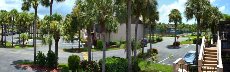 View from balcony to the tennis courts and pool area.